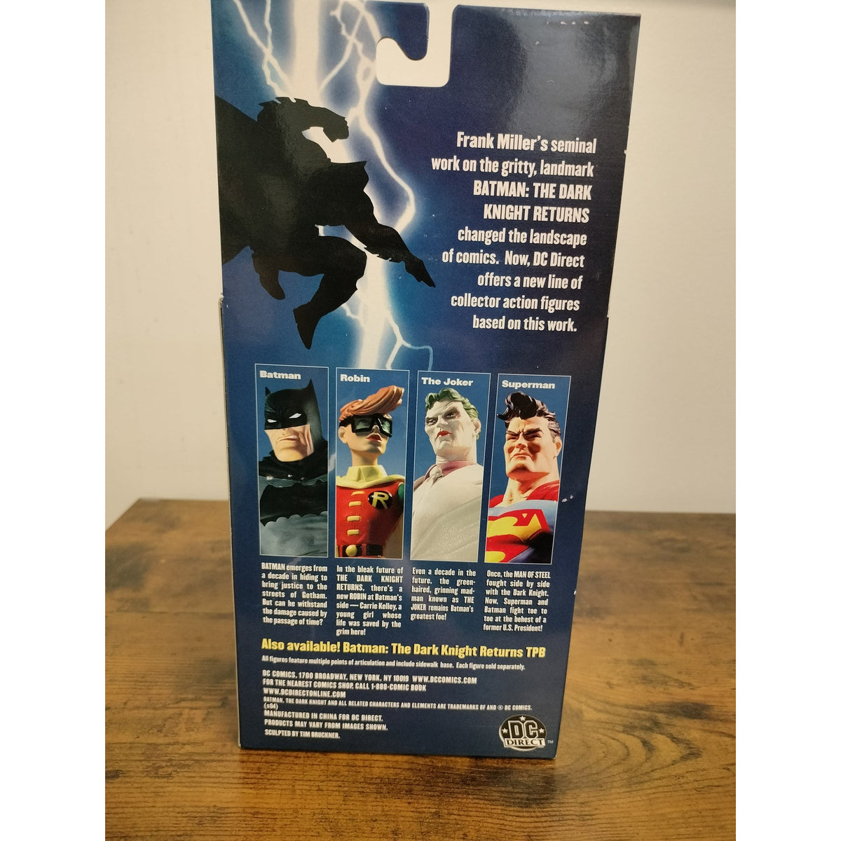 Actual item: rear of 2004 DC Direct Batman The Dark Knight Returns packaging showing printed details and edge wear