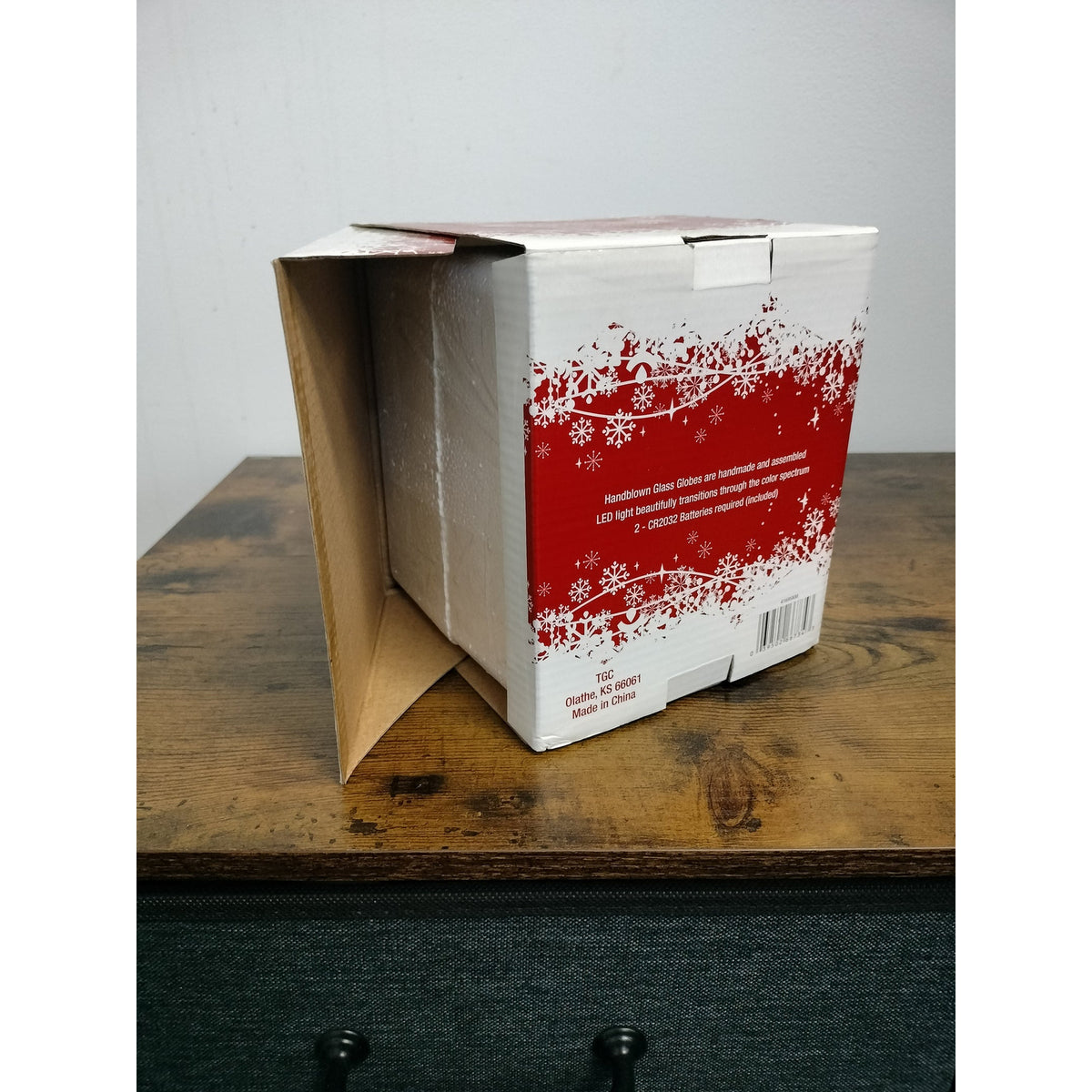 Actual item: TGC angel globe box rear showing maker, battery information, foam insert and packaging wear