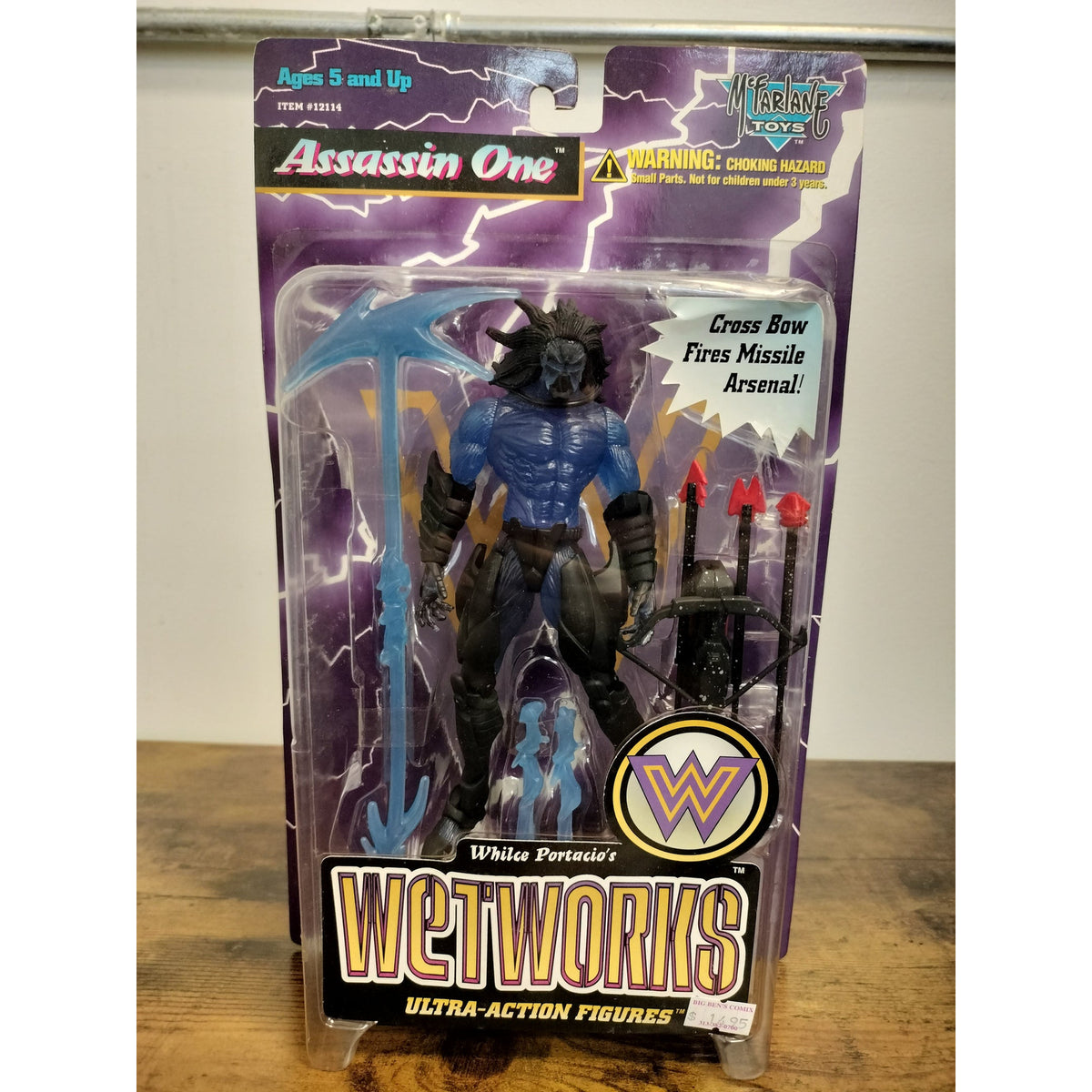 Actual item: 1996 McFarlane Wetworks Series 2 Assassin One blue figure and accessories, front view