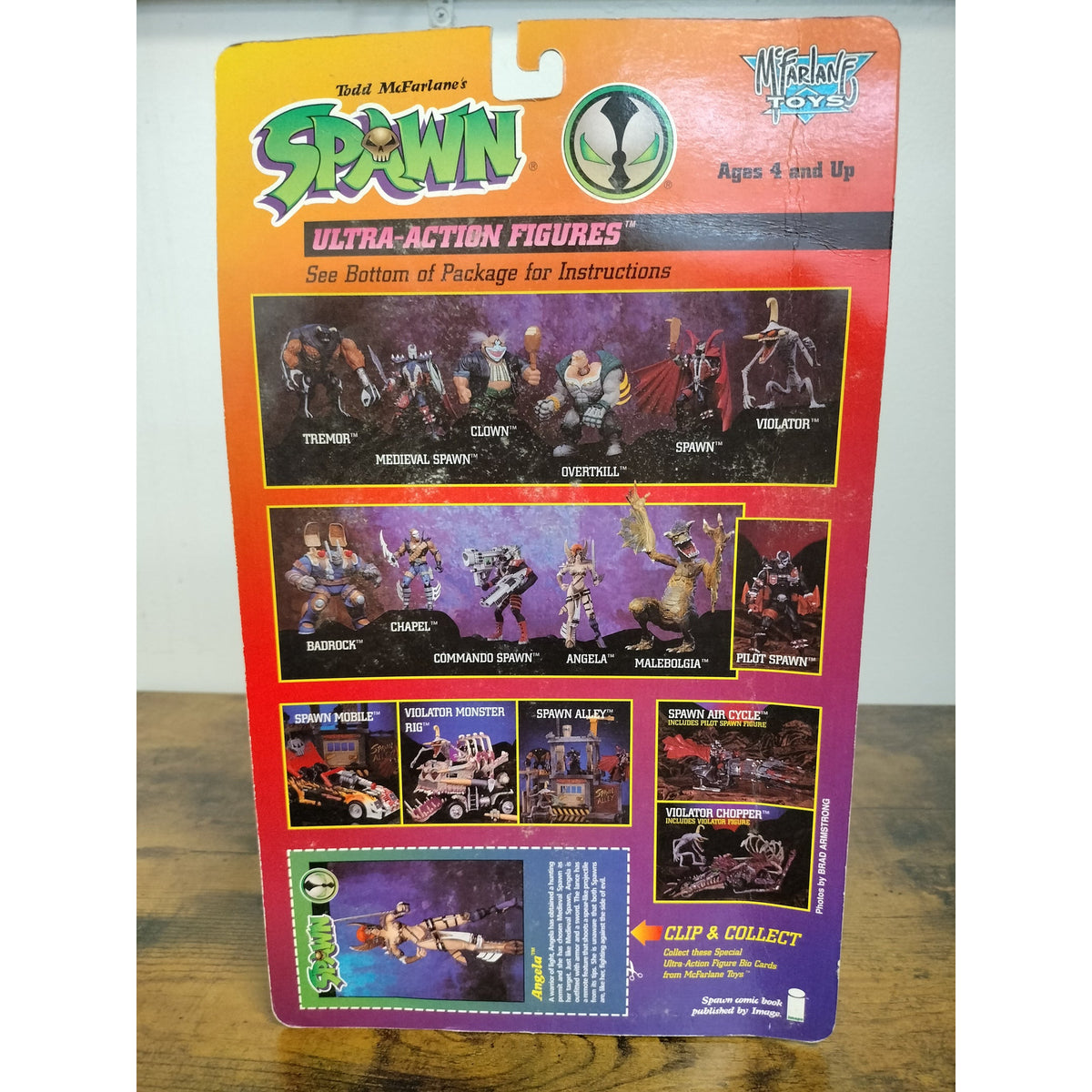 Actual Angela rear packaging showing moderate shelf wear and creasing